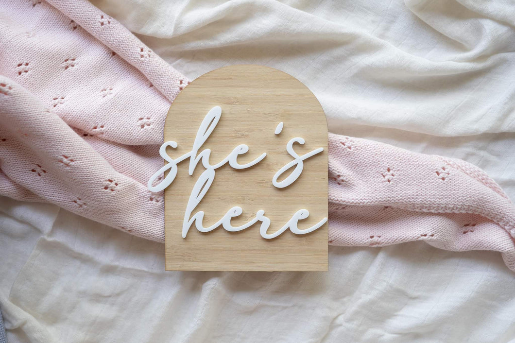 'She's here' wooden arch